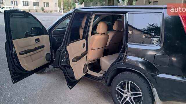 Черный Ниссан ИксТрейл, объемом двигателя 2 л и пробегом 300 тыс. км за 6300 $, фото 11 на Automoto.ua