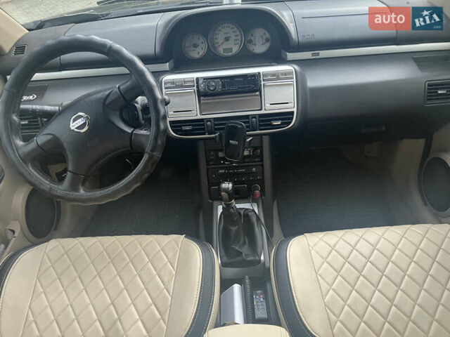 Черный Ниссан ИксТрейл, объемом двигателя 2.2 л и пробегом 356 тыс. км за 6000 $, фото 1 на Automoto.ua