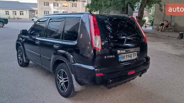 Черный Ниссан ИксТрейл, объемом двигателя 2 л и пробегом 300 тыс. км за 6300 $, фото 8 на Automoto.ua