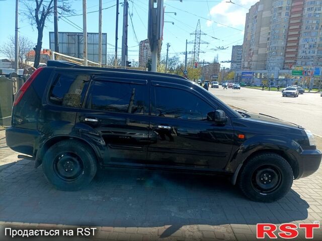 Черный Ниссан ИксТрейл, объемом двигателя 2.2 л и пробегом 333 тыс. км за 6500 $, фото 4 на Automoto.ua