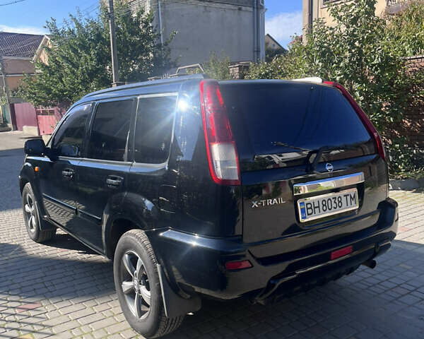 Черный Ниссан ИксТрейл, объемом двигателя 2.49 л и пробегом 176 тыс. км за 7800 $, фото 12 на Automoto.ua