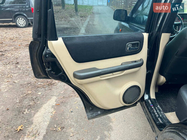 Черный Ниссан ИксТрейл, объемом двигателя 2 л и пробегом 215 тыс. км за 6490 $, фото 15 на Automoto.ua