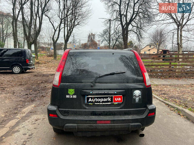 Черный Ниссан ИксТрейл, объемом двигателя 2 л и пробегом 215 тыс. км за 6490 $, фото 5 на Automoto.ua