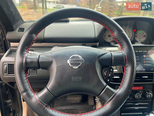 Черный Ниссан ИксТрейл, объемом двигателя 2 л и пробегом 215 тыс. км за 6490 $, фото 11 на Automoto.ua