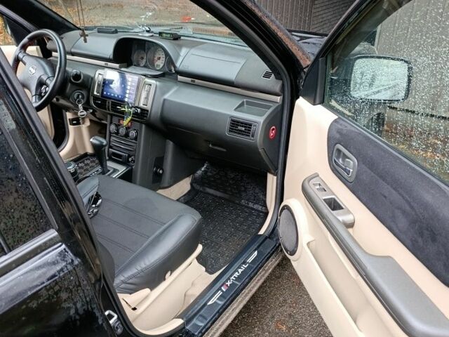 Чорний Ніссан ІксТрейл, об'ємом двигуна 2 л та пробігом 213 тис. км за 7538 $, фото 7 на Automoto.ua