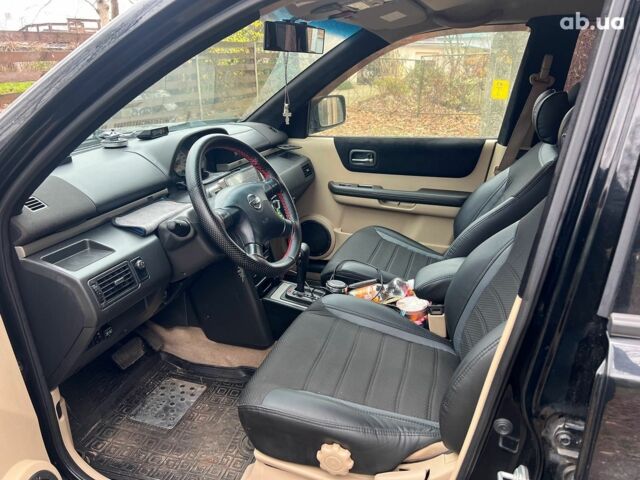 Чорний Ніссан ІксТрейл, об'ємом двигуна 2 л та пробігом 215 тис. км за 6490 $, фото 9 на Automoto.ua