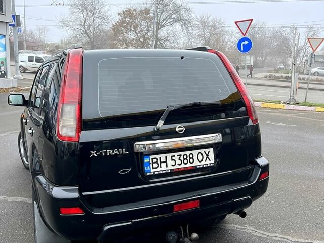 Черный Ниссан ИксТрейл, объемом двигателя 2.2 л и пробегом 308 тыс. км за 7500 $, фото 3 на Automoto.ua