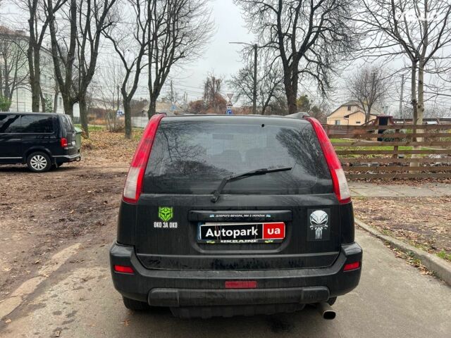 Чорний Ніссан ІксТрейл, об'ємом двигуна 2 л та пробігом 215 тис. км за 6490 $, фото 5 на Automoto.ua