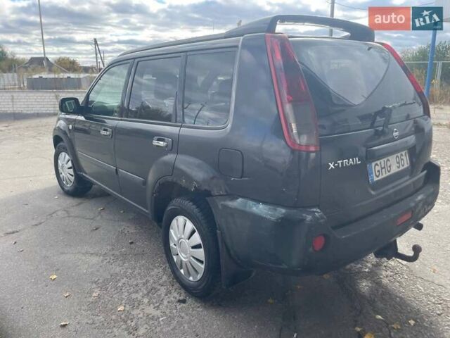Черный Ниссан ИксТрейл, объемом двигателя 2.2 л и пробегом 308 тыс. км за 2800 $, фото 2 на Automoto.ua