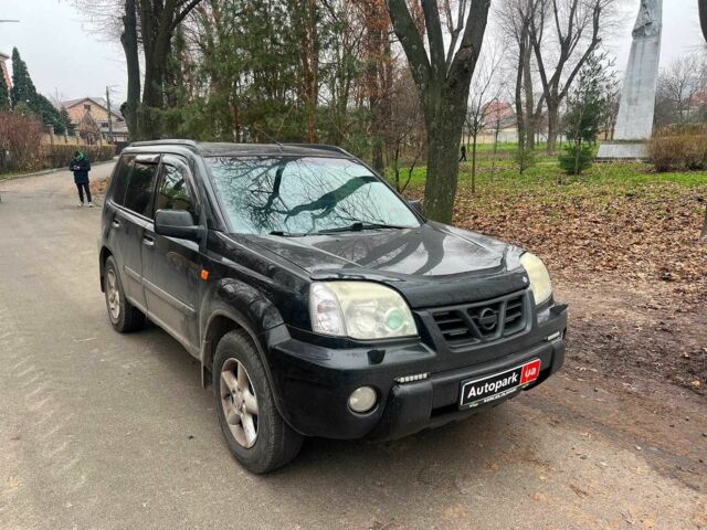 Черный Ниссан ИксТрейл, объемом двигателя 2 л и пробегом 215 тыс. км за 6490 $, фото 2 на Automoto.ua