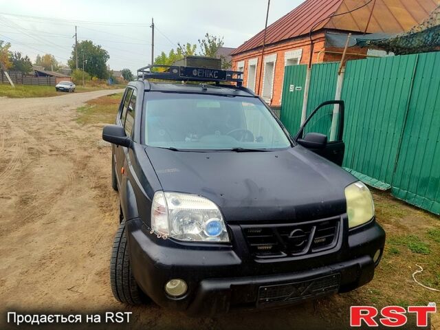 Черный Ниссан ИксТрейл, объемом двигателя 2.2 л и пробегом 357 тыс. км за 4000 $, фото 1 на Automoto.ua