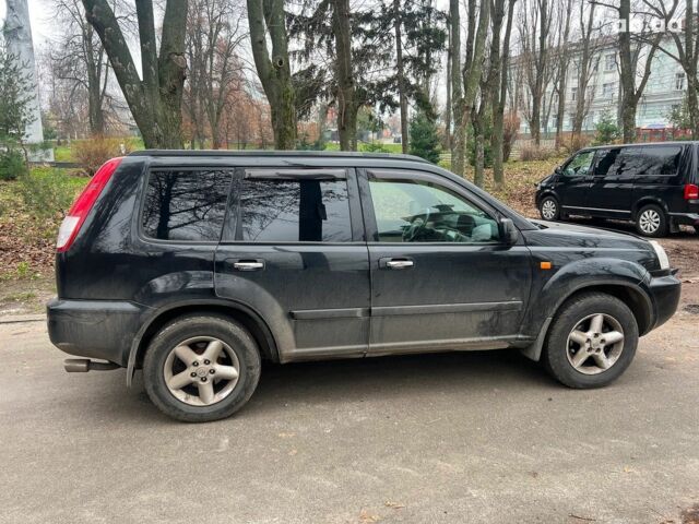 Чорний Ніссан ІксТрейл, об'ємом двигуна 2 л та пробігом 215 тис. км за 6490 $, фото 3 на Automoto.ua