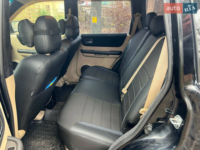 Черный Ниссан ИксТрейл, объемом двигателя 2 л и пробегом 215 тыс. км за 6490 $, фото 16 на Automoto.ua