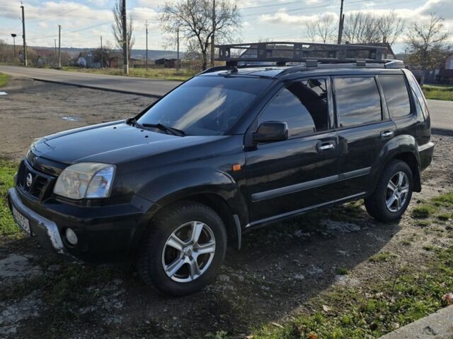 Черный Ниссан ИксТрейл, объемом двигателя 2 л и пробегом 365 тыс. км за 4013 $, фото 9 на Automoto.ua