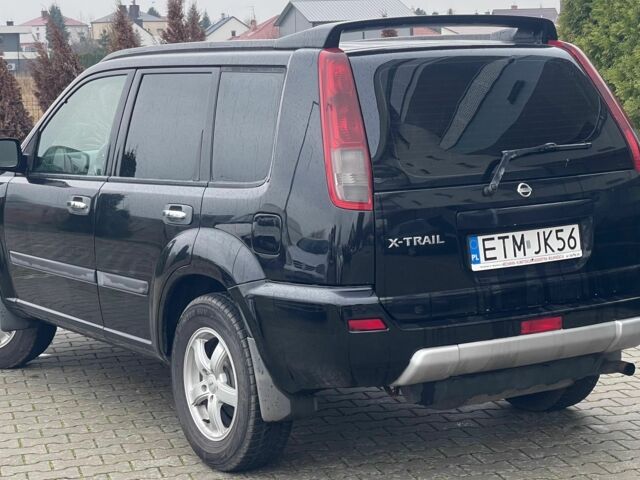 Черный Ниссан ИксТрейл, объемом двигателя 2.2 л и пробегом 290 тыс. км за 3841 $, фото 3 на Automoto.ua