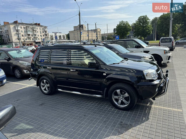 Черный Ниссан ИксТрейл, объемом двигателя 2.5 л и пробегом 318 тыс. км за 8000 $, фото 3 на Automoto.ua