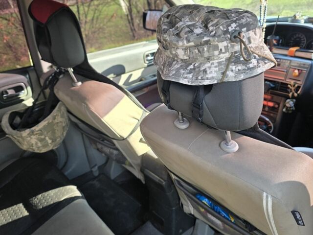 Черный Ниссан ИксТрейл, объемом двигателя 2 л и пробегом 365 тыс. км за 4013 $, фото 4 на Automoto.ua