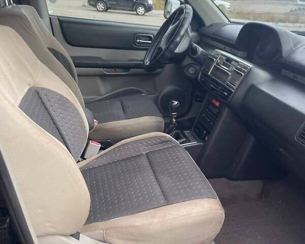 Черный Ниссан ИксТрейл, объемом двигателя 2.2 л и пробегом 308 тыс. км за 2800 $, фото 4 на Automoto.ua