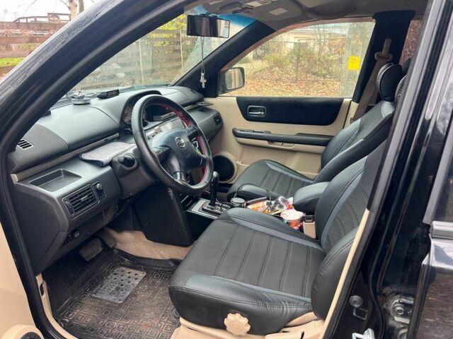 Черный Ниссан ИксТрейл, объемом двигателя 2 л и пробегом 215 тыс. км за 6490 $, фото 9 на Automoto.ua