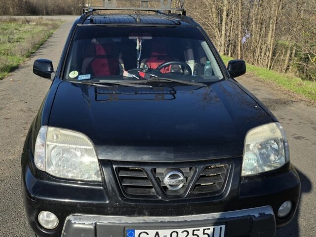 Черный Ниссан ИксТрейл, объемом двигателя 2 л и пробегом 365 тыс. км за 4013 $, фото 3 на Automoto.ua