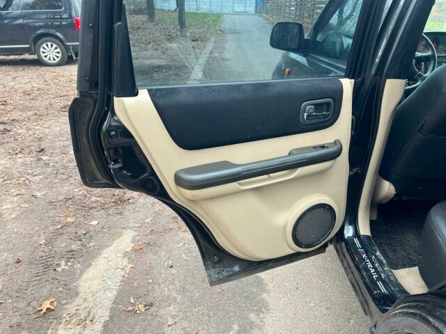 Черный Ниссан ИксТрейл, объемом двигателя 2 л и пробегом 215 тыс. км за 6490 $, фото 15 на Automoto.ua