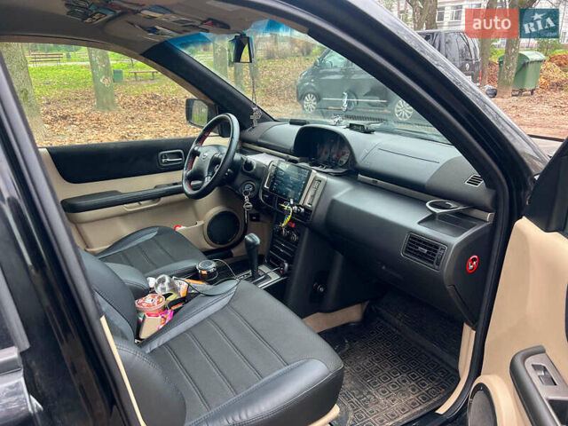 Черный Ниссан ИксТрейл, объемом двигателя 2 л и пробегом 215 тыс. км за 6490 $, фото 17 на Automoto.ua