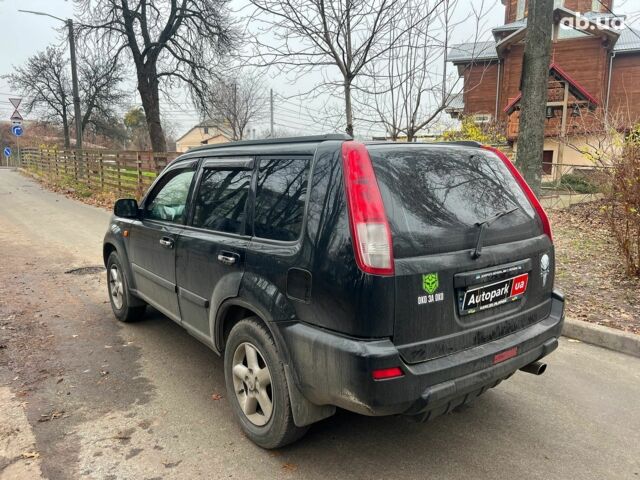 Чорний Ніссан ІксТрейл, об'ємом двигуна 2 л та пробігом 215 тис. км за 6490 $, фото 6 на Automoto.ua