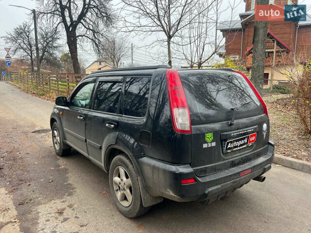 Черный Ниссан ИксТрейл, объемом двигателя 2 л и пробегом 215 тыс. км за 6490 $, фото 6 на Automoto.ua