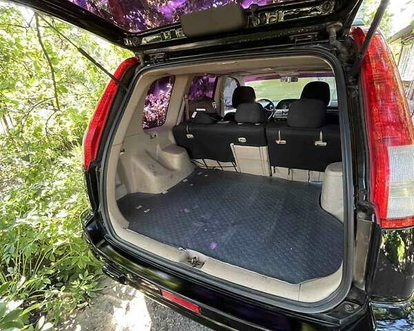 Черный Ниссан ИксТрейл, объемом двигателя 2.5 л и пробегом 287 тыс. км за 7700 $, фото 14 на Automoto.ua