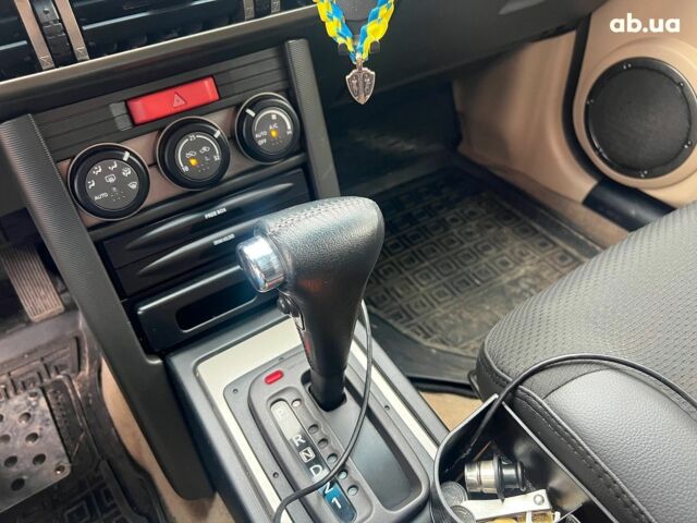 Чорний Ніссан ІксТрейл, об'ємом двигуна 2 л та пробігом 215 тис. км за 6490 $, фото 13 на Automoto.ua