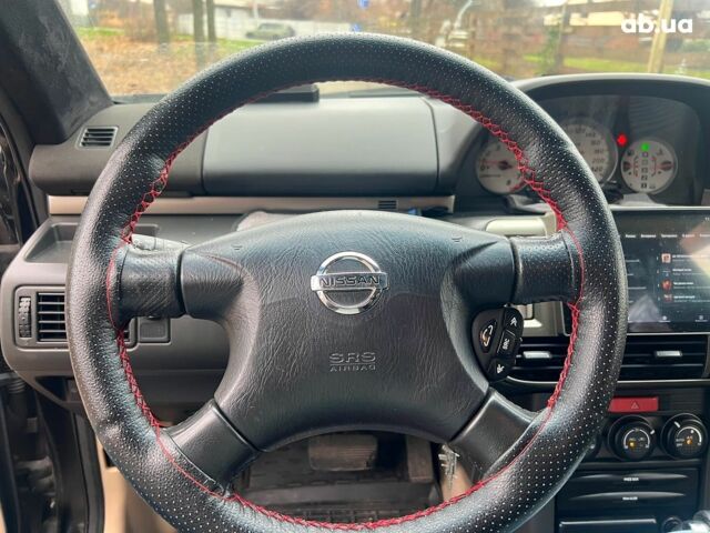 Чорний Ніссан ІксТрейл, об'ємом двигуна 2 л та пробігом 215 тис. км за 6490 $, фото 11 на Automoto.ua