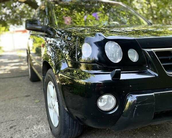 Черный Ниссан ИксТрейл, объемом двигателя 2.5 л и пробегом 287 тыс. км за 7700 $, фото 5 на Automoto.ua