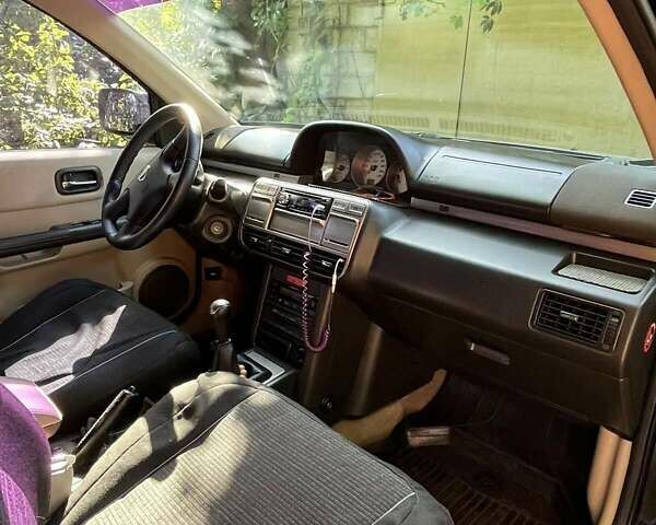 Черный Ниссан ИксТрейл, объемом двигателя 2.5 л и пробегом 287 тыс. км за 7700 $, фото 15 на Automoto.ua