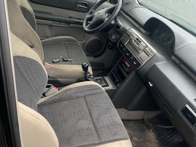 Черный Ниссан ИксТрейл, объемом двигателя 2.2 л и пробегом 370 тыс. км за 2950 $, фото 7 на Automoto.ua