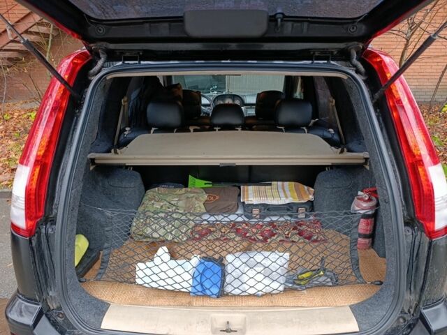 Чорний Ніссан ІксТрейл, об'ємом двигуна 2 л та пробігом 213 тис. км за 7538 $, фото 4 на Automoto.ua