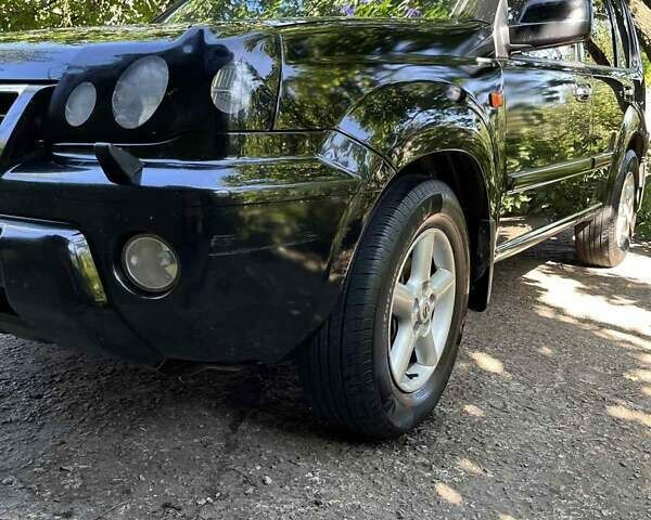 Черный Ниссан ИксТрейл, объемом двигателя 2.5 л и пробегом 287 тыс. км за 7700 $, фото 21 на Automoto.ua