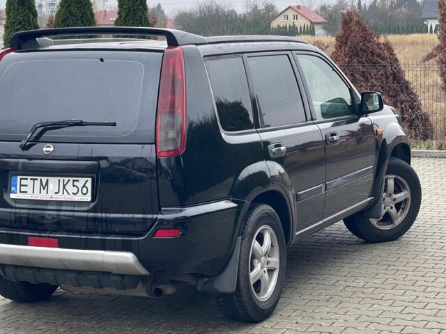 Черный Ниссан ИксТрейл, объемом двигателя 2.2 л и пробегом 290 тыс. км за 3841 $, фото 5 на Automoto.ua