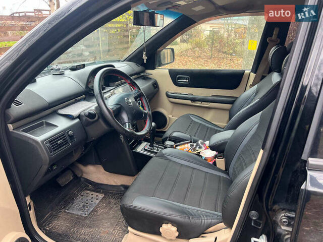 Черный Ниссан ИксТрейл, объемом двигателя 2 л и пробегом 215 тыс. км за 6490 $, фото 9 на Automoto.ua