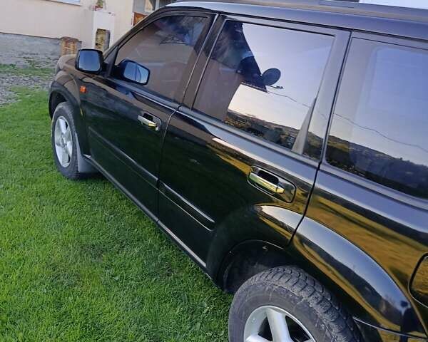 Черный Ниссан ИксТрейл, объемом двигателя 2 л и пробегом 276 тыс. км за 6000 $, фото 5 на Automoto.ua