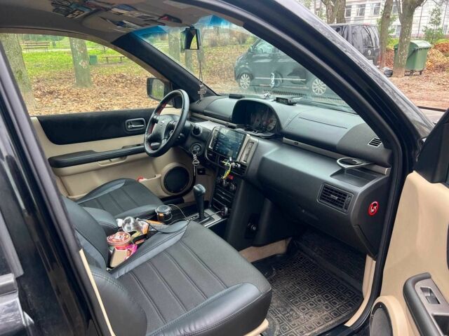 Черный Ниссан ИксТрейл, объемом двигателя 2 л и пробегом 215 тыс. км за 6490 $, фото 17 на Automoto.ua