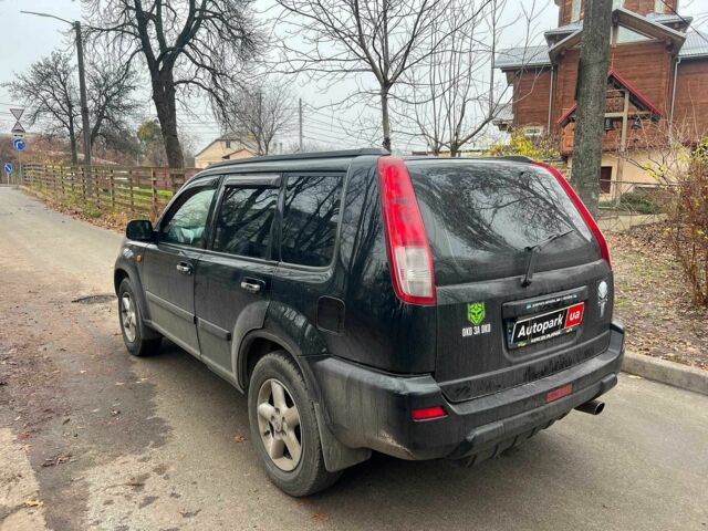 Черный Ниссан ИксТрейл, объемом двигателя 2 л и пробегом 215 тыс. км за 6490 $, фото 6 на Automoto.ua