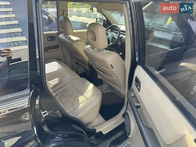 Черный Ниссан ИксТрейл, объемом двигателя 2.5 л и пробегом 318 тыс. км за 8000 $, фото 10 на Automoto.ua