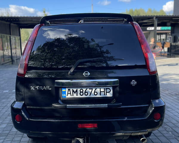 Черный Ниссан ИксТрейл, объемом двигателя 2 л и пробегом 215 тыс. км за 7000 $, фото 14 на Automoto.ua
