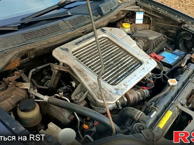 Черный Ниссан ИксТрейл, объемом двигателя 2.2 л и пробегом 294 тыс. км за 5000 $, фото 4 на Automoto.ua