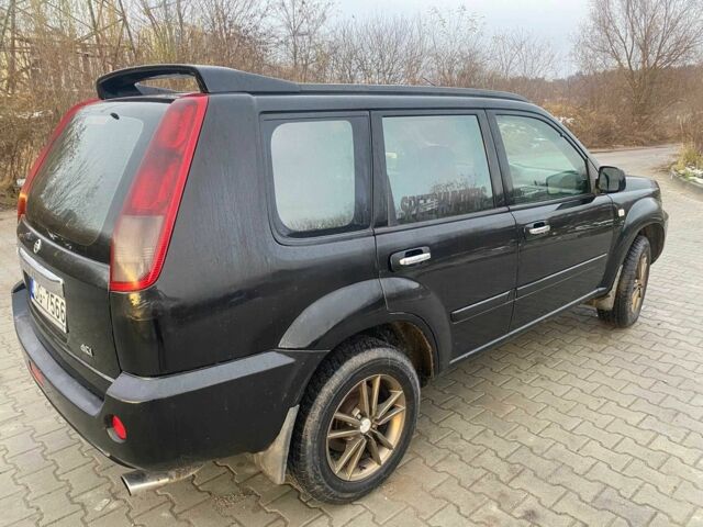 Черный Ниссан ИксТрейл, объемом двигателя 2.2 л и пробегом 251 тыс. км за 3800 $, фото 2 на Automoto.ua