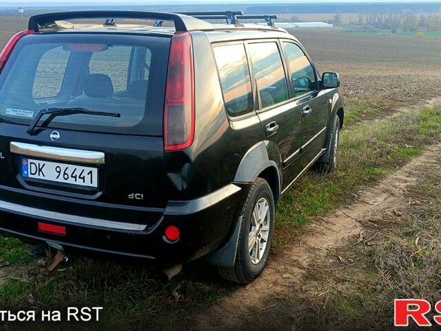 Черный Ниссан ИксТрейл, объемом двигателя 2.2 л и пробегом 294 тыс. км за 5000 $, фото 1 на Automoto.ua