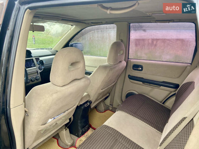 Черный Ниссан ИксТрейл, объемом двигателя 2.49 л и пробегом 300 тыс. км за 6200 $, фото 9 на Automoto.ua