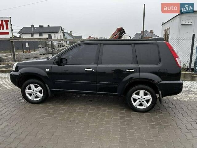 Черный Ниссан ИксТрейл, объемом двигателя 2.5 л и пробегом 282 тыс. км за 6250 $, фото 2 на Automoto.ua