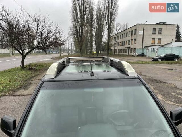 Черный Ниссан ИксТрейл, объемом двигателя 2.5 л и пробегом 285 тыс. км за 6500 $, фото 8 на Automoto.ua