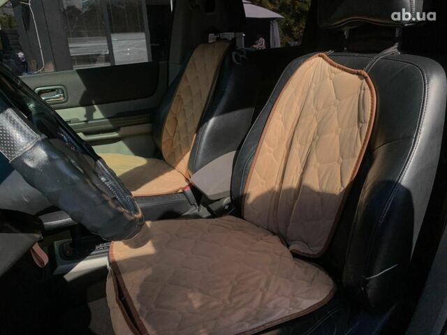 Черный Ниссан ИксТрейл, объемом двигателя 2.5 л и пробегом 295 тыс. км за 6890 $, фото 31 на Automoto.ua